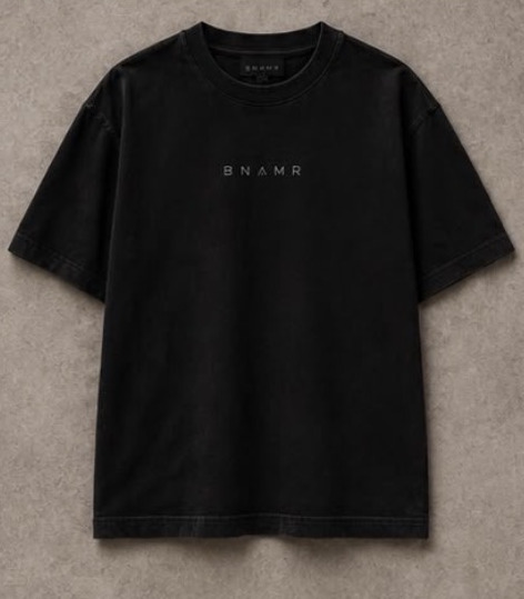 Essential Tee in black, flat lay